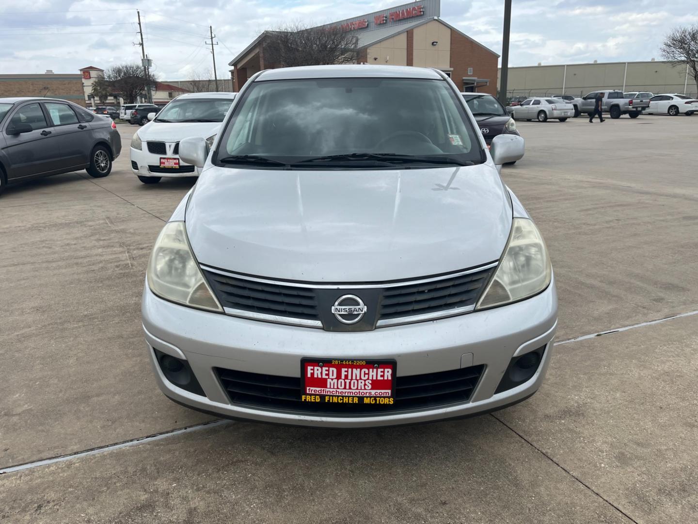 2009 SILVER /black Nissan Versa 1.8 S Hatchback (3N1BC13E09L) with an 1.8L L4 DOHC 16V engine, Manual transmission, located at 14700 Tomball Parkway 249, Houston, TX, 77086, (281) 444-2200, 29.928619, -95.504074 - Photo#1